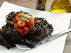 Spaghetti à l’encre de seiche et cocktail de fruits de mer